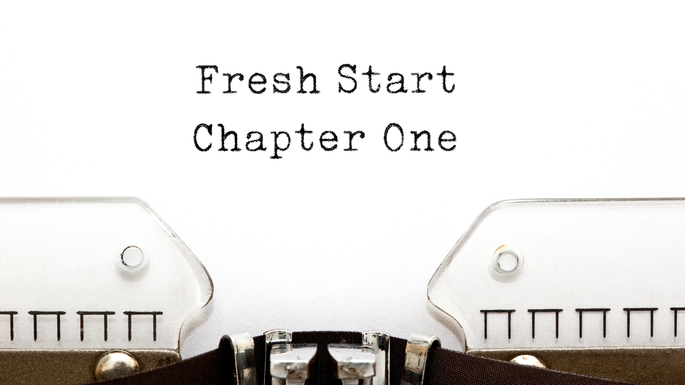Typewriter with the words 'Fresh Start Chapter One' on paper, symbolizing new beginnings, recovery, and starting a sober life journey.