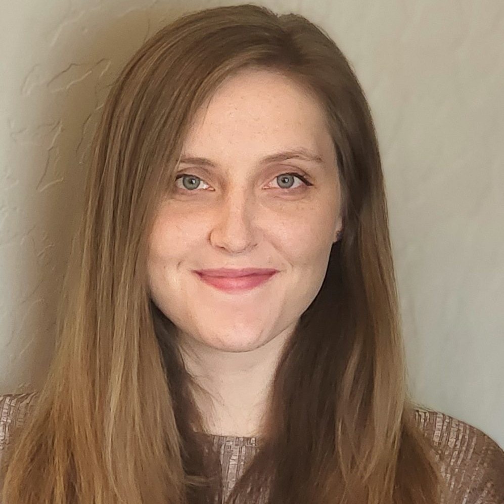 Female addiction counselor sitting in a calm, welcoming setting, offering support and guidance to individuals in recovery.